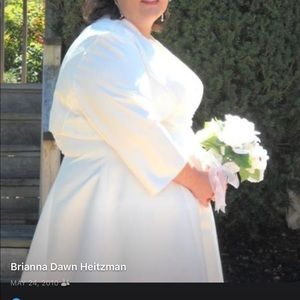 Ivory satin wedding dress, veil and jacket.